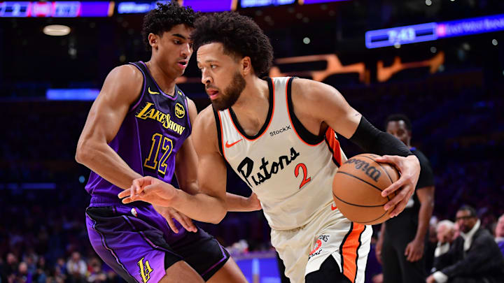 Dec 23, 2024; Los Angeles, California, USA;  Detroit Pistons guard Cade Cunningham (2) moves to the basket against Los Angeles Lakers guard Max Christie (12) during the first half at Crypto.com Arena. Mandatory Credit: Gary A. Vasquez-Imagn Images