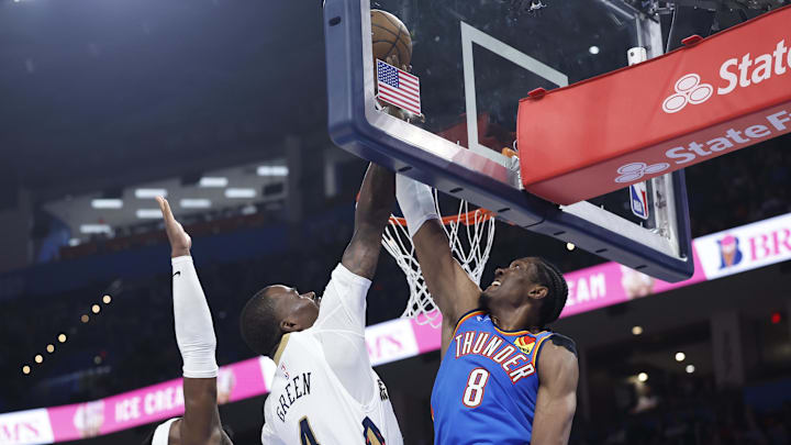 Nov 13, 2024; Oklahoma City, Oklahoma, USA; Oklahoma City Thunder forward Jalen Williams (8) blocks a shot by New Orleans Pelicans guard Javonte Green (4) during the second half at Paycom Center. Mandatory Credit: Alonzo Adams-Imagn Images