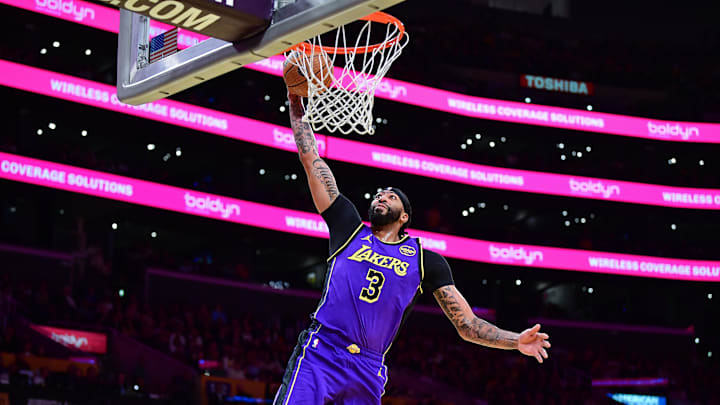 Nov 19, 2024; Los Angeles, California, USA; Los Angeles Lakers forward Anthony Davis (3) scores a basket against the Utah Jazz during the first half at Crypto.com Arena. Mandatory Credit: Gary A. Vasquez-Imagn Images