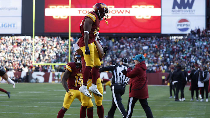 Dec 22, 2024; Landover, Maryland, USA; Washington Commanders wide receiver Jamison Crowder (80) celebrates with Commanders wide receiver Luke McCaffrey (12) after catching a touchdown pass against the Philadelphia Eagles during the first quarter at Northwest Stadium. Mandatory Credit: Geoff Burke-Imagn Images Dec 22, 2024; Landover, Maryland, USA; Washington Commanders wide receiver Jamison Crowder (80) celebrates with Commanders wide receiver Luke McCaffrey (12) after catching a touchdown pass against the Philadelphia Eagles during the first quarter at Northwest Stadium. Mandatory Credit: Geoff Burke-Imagn Images