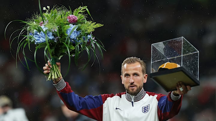 Harry Kane with his golden cap and flowers to celebrate 100 caps for England 