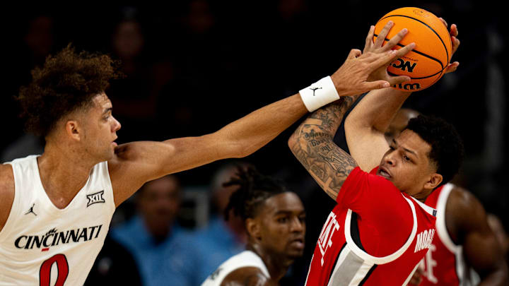 Cincinnati Bearcats guard Dan Skillings Jr. (0) covers Ohio State Buckeyes guard John Mobley Jr. (0) in the first half of a basketball scrimmage between Cincinnati Bearcats and Ohio State Buckeyes at Fifth Third Arena in Cincinnati on Friday, Oct. 18, 2024. Cincinnati Bearcats guard Dan Skillings Jr. (0) covers Ohio State Buckeyes guard John Mobley Jr. (0) in the first half of a basketball scrimmage between Cincinnati Bearcats and Ohio State Buckeyes at Fifth Third Arena in Cincinnati on Friday, Oct. 18, 2024.