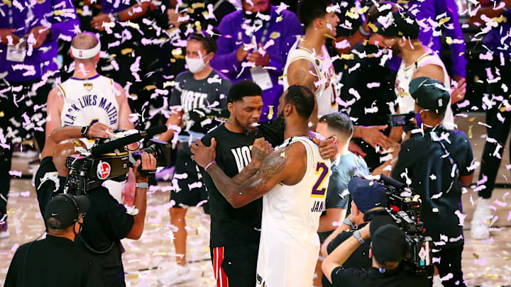 Oct 11, 2020; Lake Buena Vista, Florida, USA; Los Angeles Lakers forward LeBron James (23) hugs Miami Heat forward Udonis Haslem (40) after game six of the 2020 NBA Finals at AdventHealth Arena. The Los Angeles Lakers won 106-93 to win the series. Mandatory Credit: Kim Klement-USA TODAY Sports