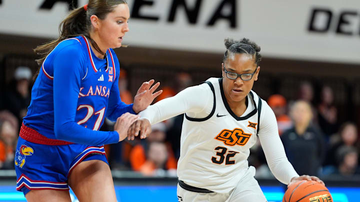 Oklahoma State Cowgirls guard Stailee Heard (32) tries to get past Kansas Jayhawks guard Elle Evans (21) during a women's BIG 12 basketball game between the Oklahoma State University Cowgirls (OSU) and the Kansas Jayhawks at Gallagher-Iba Arena in Stillwater, Okla., Saturday, Jan. 4, 2025.