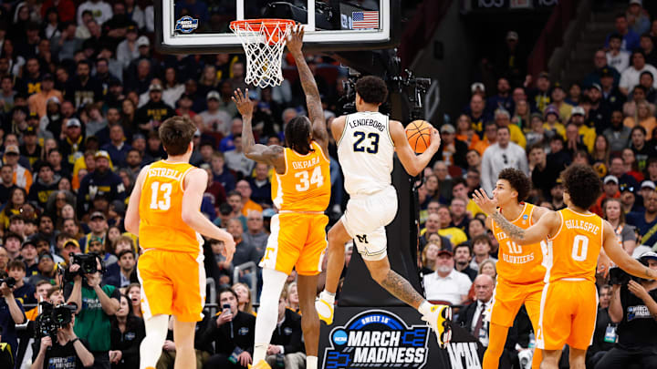 Mar 29, 2026; Chicago, IL, USA; Michigan Wolverines forward Yaxel Lendeborg (23) shoots while defended by Tennessee Volunteers forward Felix Okpara (34) in the first half during an Elite Eight game of the Midwest Regional of the men's 2026 NCAA Tournament at United Center. Mandatory Credit: Kamil Krzaczynski-Imagn Images