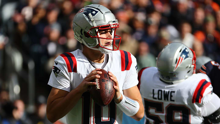 Nov 10, 2024; Chicago, Illinois, USA; New England Patriots quarterback Drake Maye (10) drops back to pass against the Chicago Bears during the first quarter at Soldier Field.