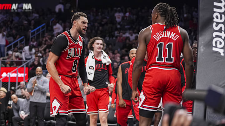 Nov 9, 2024; Atlanta, Georgia, USA; Chicago Bulls guard Zach LaVine (8) reacts after guard Ayo Dosunmu (11) scored a basket against the Atlanta Hawks during the second half at State Farm Arena. Mandatory Credit: Dale Zanine-Imagn Images