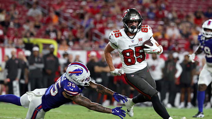 Aug 23, 2025; Tampa, Florida, USA; Tampa Bay Buccaneers wide receiver Garrett Greene (85) runs past Buffalo Bills linebacker Jimmy Ciarlo (35) during the second half at Raymond James Stadium. Mandatory Credit: Kim Klement Neitzel-Imagn Images