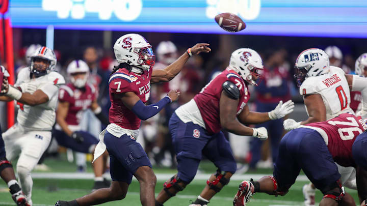 South Carolina State Bulldogs quarterback Eric Phoenix (7) throws a pass against the Jackson State Tigers in the fourth quarter of the Cricket Celebration Bowl. 
