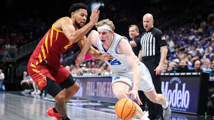 Mar 13, 2025; Kansas City, MO, USA; Brigham Young Cougars forward Richie Saunders (15) drives to the basket around Iowa State Cyclones forward Joshua Jefferson (2) during the first half at T-Mobile Center. Mandatory Credit: William Purnell-Imagn Images
