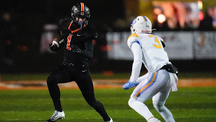 Ryle Raiders wide receiver Landon Lorms (1) runs down the field with the ball in the second quarter of a high school football game between the Ryle Raiders and Central Hardin Bruins, Friday, Nov. 22, 2024, at Clifford R. Borland, Sr. Stadium in Union, Ky. Ryle Raiders wide receiver Landon Lorms (1) runs down the field with the ball in the second quarter of a high school football game between the Ryle Raiders and Central Hardin Bruins, Friday, Nov. 22, 2024, at Clifford R. Borland, Sr. Stadium in Union, Ky.