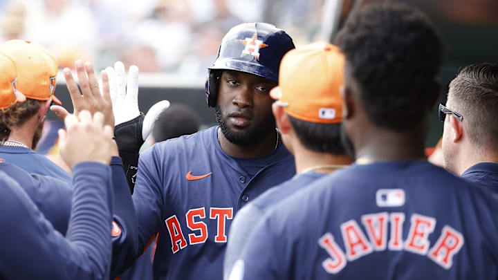 Mar 7, 2024; Jupiter, Florida, USA; Houston Astros designated hitter Yordan Alvarez (44) is greeted