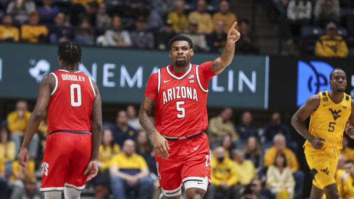Jan 7, 2025; Morgantown, West Virginia, USA; Arizona Wildcats guard KJ Lewis (5) celebrates a made basket during the first half against the West Virginia Mountaineers at WVU Coliseum. Mandatory Credit: Ben Queen-Imagn Images