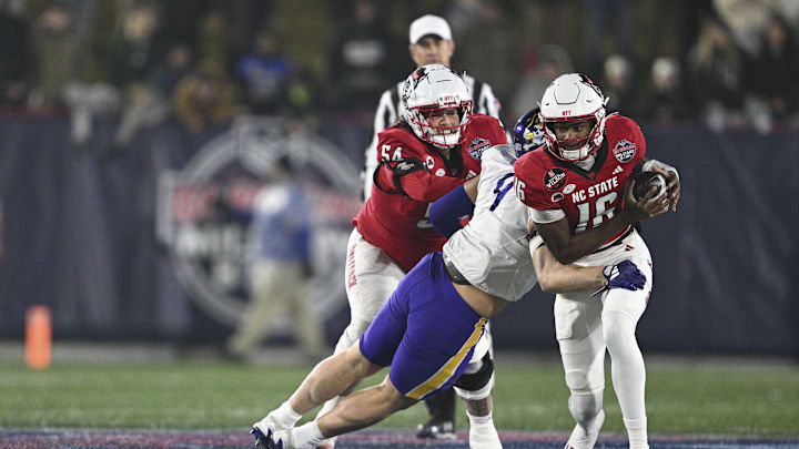 Dec 28, 2024; Annapolis, MD, USA; East Carolina Pirates defensive lineman J.D. Lampley (9) sacks North Carolina State Wolfpack quarterback CJ Bailey (16) during the first half of the Go Bowling Military Bowl at Navy-Marine Corps Memorial Stadium. Mandatory Credit: Tommy Gilligan-Imagn Images Dec 28, 2024; Annapolis, MD, USA; East Carolina Pirates defensive lineman J.D. Lampley (9) sacks North Carolina State Wolfpack quarterback CJ Bailey (16) during the first half of the Go Bowling Military Bowl at Navy-Marine Corps Memorial Stadium. Mandatory Credit: Tommy Gilligan-Imagn Images