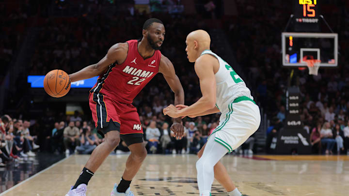 Mar 14, 2025; Miami, Florida, USA; Miami Heat forward Andrew Wiggins (22) drives to the basket against Boston Celtics guard Jordan Walsh (27) during the second quarter at Kaseya Center. Mandatory Credit: Sam Navarro-Imagn Images