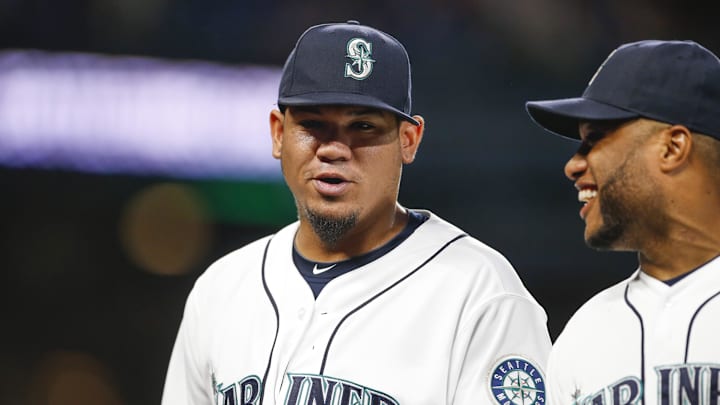 Seattle Mariners pitcher Felix Hernandez ( left) and second baseman Robinson Cano (22) talk as they walk to the dugout following the final out of the seventh inning against the Toronto Blue Jays at Safeco Field in 2015.