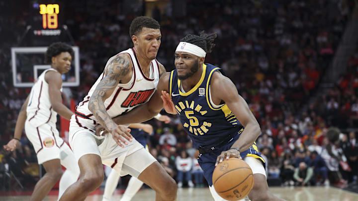 Nov 20, 2024; Houston, Texas, USA; Indiana Pacers forward Jarace Walker (5) drives with the ball as Houston Rockets forward Jabari Smith Jr. (10) defends during the third quarter at Toyota Center. Mandatory Credit: Troy Taormina-Imagn Images Nov 20, 2024; Houston, Texas, USA; Indiana Pacers forward Jarace Walker (5) drives with the ball as Houston Rockets forward Jabari Smith Jr. (10) defends during the third quarter at Toyota Center. Mandatory Credit: Troy Taormina-Imagn Images