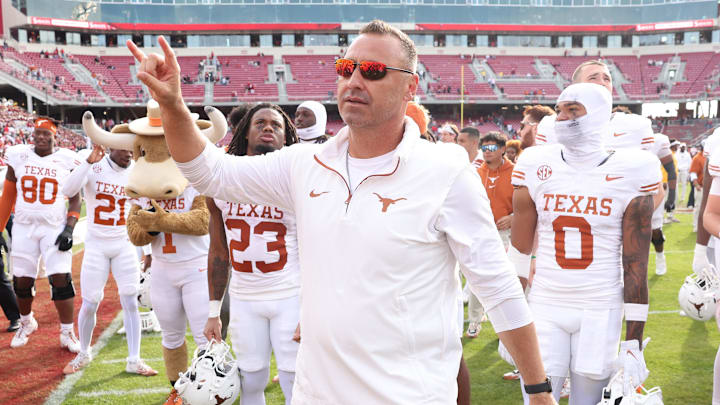 Nov 16, 2024; Fayetteville, Arkansas, USA; Texas Longhorns head coach Steve Sarkisian celebrates after the game against the Arkansas Razorbacks at Donald W. Reynolds Razorback Stadium. Texas won 20-10. Mandatory Credit: Nelson Chenault-Imagn Images