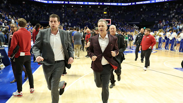 Arkansas head basketball coach John Calipari exits the court going into halftime of Saturday's 89-79 win over the Kentucky Wildcats in Rupp Arena. 