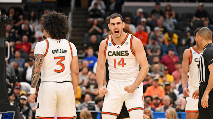 Mar 20, 2026; St. Louis, MO, USA; Miami (FL) Hurricanes guard Noam Dovrat (14) reacts after a play during the second half against the Missouri Tigers during a first round game of the men's 2026 NCAA Tournament at Enterprise Center. Mandatory Credit: Jeff Curry-Imagn Images Mar 20, 2026; St. Louis, MO, USA; Miami (FL) Hurricanes guard Noam Dovrat (14) reacts after a play during the second half against the Missouri Tigers during a first round game of the men's 2026 NCAA Tournament at Enterprise Center. Mandatory Credit: Jeff Curry-Imagn Images