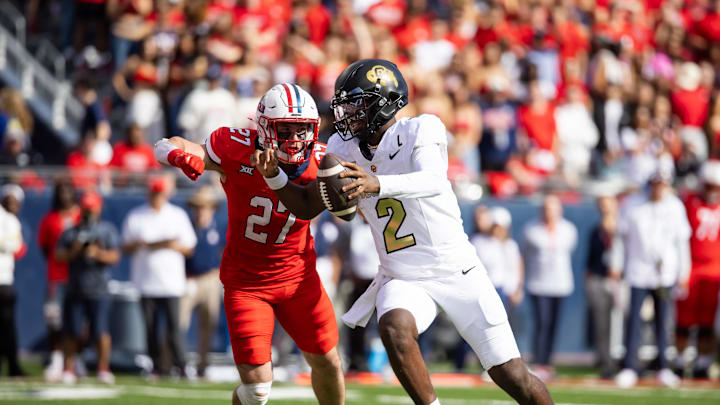 Oct 19, 2024; Tucson, Arizona, USA; Colorado Buffaloes quarterback Shedeur Sanders (2) against Arizona Wildcats defensive back Owen Goss (27) at Arizona Stadium. Mandatory Credit: Mark J. Rebilas-Imagn Images Oct 19, 2024; Tucson, Arizona, USA; Colorado Buffaloes quarterback Shedeur Sanders (2) against Arizona Wildcats defensive back Owen Goss (27) at Arizona Stadium. Mandatory Credit: Mark J. Rebilas-Imagn Images