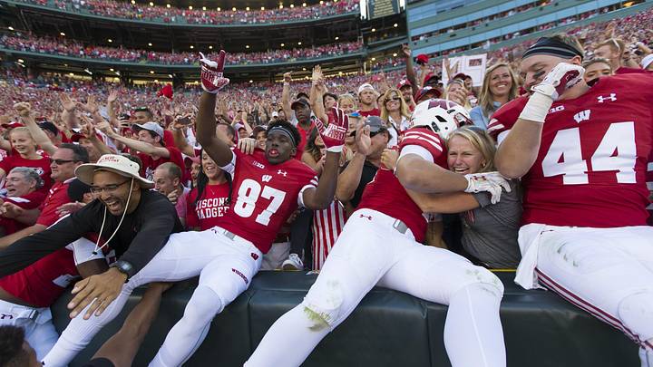 Wisconsin Badgers players celebrate defeating the LSU Tigers by doing the Lambeau Leap.
