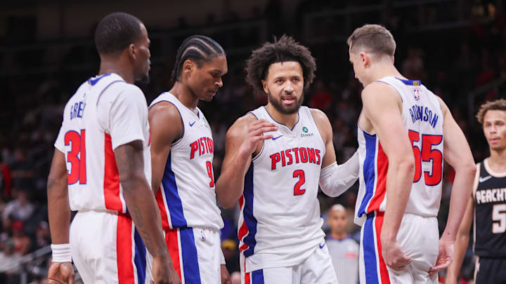 Nov 18, 2025; Atlanta, Georgia, USA; Detroit Pistons guard Javonte Green (31) and guard Ausar Thompson (9) and guard Cade Cunningham (2) and forward Duncan Robinson (55) against the Atlanta Hawks in the fourth quarter at State Farm Arena. Mandatory Credit: Brett Davis-Imagn Images