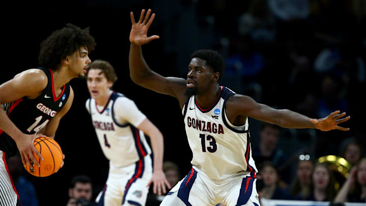 Gonzaga Bulldogs forward Graham Ike (13) defends Georgia Bulldogs forward Asa Newell (14) in the first half of a first round men’s NCAA Tournament game at Intrust Bank Arena
