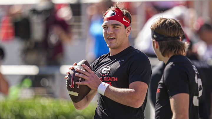 Georgia Bulldogs quarterback Gunner Stockton (14) shown on the field prior to playing the Mississippi State Bulldogs at Sanford Stadium. 