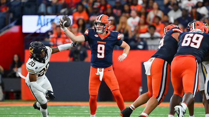 Sep 12, 2026; Syracuse, New York, USA; Syracuse Orange quarterback Steve Angeli (9) avoids the pressure of California Golden Bears defensive back Cam Sidney (20) during the first half at the JMA Wireless Dome. Mandatory Credit: Rich Barnes-Imagn Images Sep 12, 2026; Syracuse, New York, USA; Syracuse Orange quarterback Steve Angeli (9) avoids the pressure of California Golden Bears defensive back Cam Sidney (20) during the first half at the JMA Wireless Dome. Mandatory Credit: Rich Barnes-Imagn Images