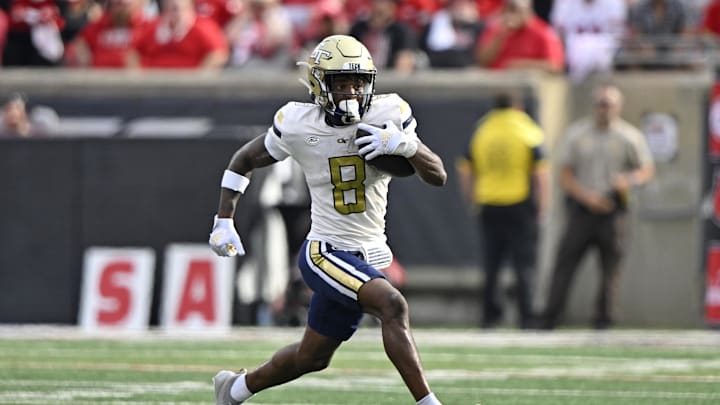 Sep 21, 2024; Louisville, Kentucky, USA;  Georgia Tech Yellow Jackets wide receiver Malik Rutherford (8) runs the ball against the Louisville Cardinals during the first half at L&N Federal Credit Union Stadium. Mandatory Credit: Jamie Rhodes-Imagn Images