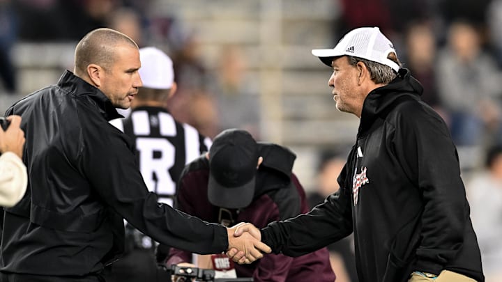 Texas A&M Aggies head coach Jimbo Fisher, right, and Mississippi State Bulldogs head coach Zach Arnett, left, shake hands prior to the game at Kyle Field. 
