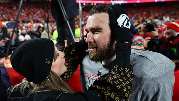 Jan 26, 2025; Kansas City, MO, USA; Recording artist Taylor Swift and Kansas City Chiefs tight end Travis Kelce (87) react after the AFC Championship game against the Buffalo Bills at GEHA Field at Arrowhead Stadium. Mandatory Credit: Mark J. Rebilas-Imagn Images Jan 26, 2025; Kansas City, MO, USA; Recording artist Taylor Swift and Kansas City Chiefs tight end Travis Kelce (87) react after the AFC Championship game against the Buffalo Bills at GEHA Field at Arrowhead Stadium. Mandatory Credit: Mark J. Rebilas-Imagn Images