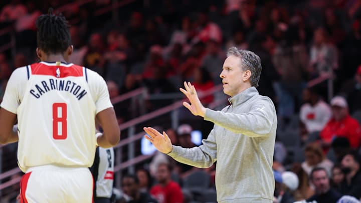 Nov 15, 2024; Atlanta, Georgia, USA; Washington Wizards Head Coach Brian Keefe and Washington Wizards guard Carlton Carrington (8) in the game against the Atlanta Hawks during the first quarter at State Farm Arena. Mandatory Credit: Jordan Godfree-Imagn Images
