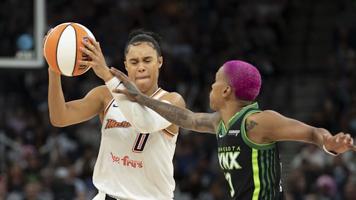 2Sep 23, 2025; Minneapolis, Minnesota, USA; Phoenix Mercury forward Satou Sabally (0) drives against Minnesota Lynx guard Courtney Williams (10) in the second half during game two of the second round for the 2025 WNBA Playoffs at Target Center. Mandatory Credit: Jesse Johnson-Imagn Images