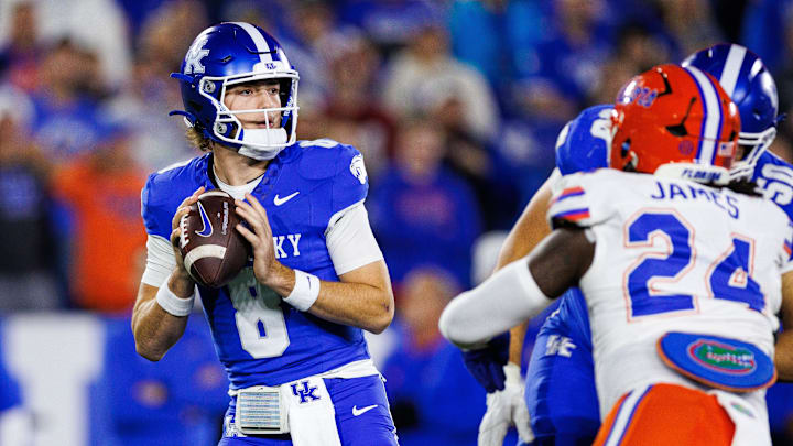 Nov 8, 2025; Lexington, Kentucky, USA; Kentucky Wildcats quarterback Cutter Boley (8) looks for a receiver during the first quarter against the Florida Gators at Kroger Field. Mandatory Credit: Jordan Prather-Imagn Images