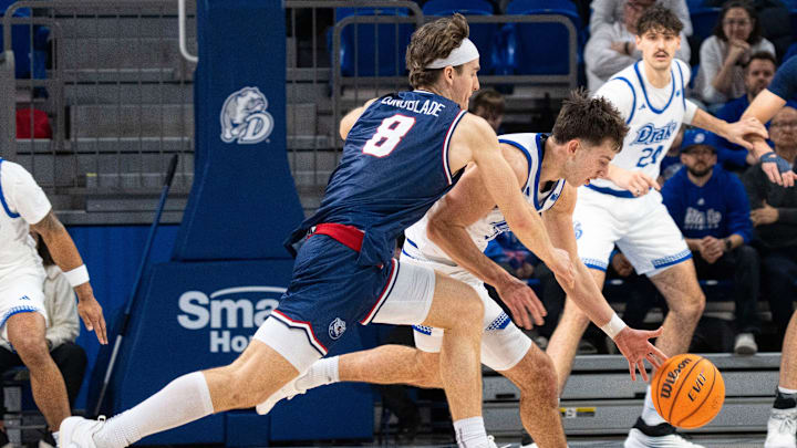 Drake's Andrew Alia tips the ball from Belmont's Tyler Lundblade during a game at Knapp Center on Saturday, Jan. 10, 2026 in Des Moines.
