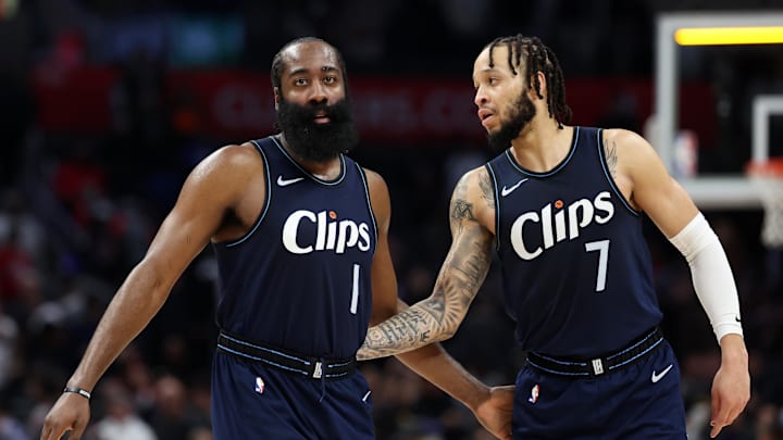 Dec 29, 2023; Los Angeles, California, USA;  Los Angeles Clippers guard James Harden (1) and guard Amir Coffey (7) celebrate a victory after defeating the Memphis Grizzlies 117-106 at Crypto.com Arena. Mandatory Credit: Kiyoshi Mio-Imagn Images