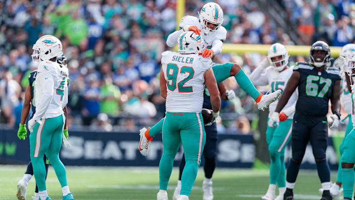 Miami Dolphins defensive tackle Zach Sieler (92) celebrates an interception during the third quarter against the Seattle Seahawks at Lumen Field in Week 3.