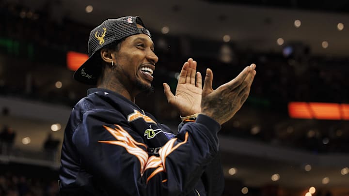 Mar 2, 2022; Milwaukee, Wisconsin, USA;  Former Milwaukee Bucks player Brandon Jennings cheers during the fourth quarter against the Miami Heat at Fiserv Forum. Mandatory Credit: Jeff Hanisch-Imagn Images