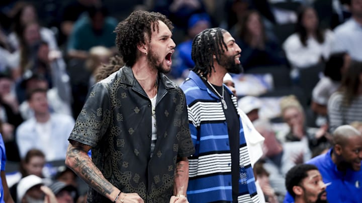 Feb 27, 2025; Dallas, Texas, USA;  Dallas Mavericks center Dereck Lively II (2) and Dallas Mavericks forward Anthony Davis (3) react on the bench against the Charlotte Hornets during the first half at American Airlines Center. Mandatory Credit: Kevin Jairaj-Imagn Images