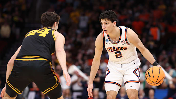 Mar 28, 2026; Houston, TX, USA; Illinois Fighting Illini guard Andrej Stojakovic (2) controls the ball against Iowa Hawkeyes guard Tate Sage (24) in the first half during an Elite Eight game of the South Regional of the men's 2026 NCAA Tournament at Toyota Center. Mandatory Credit: Troy Taormina-Imagn Images