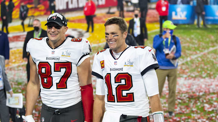 Feb 7, 2021; Tampa, FL, USA;  Tampa Bay Buccaneers quarterback Tom Brady (12) and tight end Rob Gronkowski (87) celebrate after beating the Kansas City Chiefs in Super Bowl LV at Raymond James Stadium.  Mandatory Credit: Mark J. Rebilas-Imagn Images
