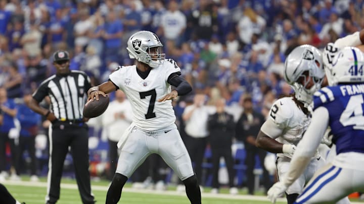 Oct 5, 2025; Indianapolis, Indiana, USA; Las Vegas Raiders quarterback Geno Smith (7) looks to pass the ball against the Indianapolis Colts during the second quarter at Lucas Oil Stadium. Mandatory Credit: Trevor Ruszkowski-Imagn Images