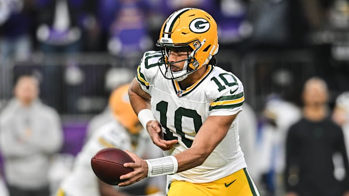 Dec 29, 2024; Minneapolis, Minnesota, USA; Green Bay Packers quarterback Jordan Love (10) looks to hand the ball off against the Minnesota Vikings during the first quarter at U.S. Bank Stadium. Mandatory Credit: Jeffrey Becker-Imagn Images