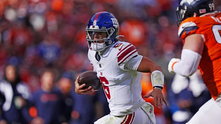 Oct 19, 2025; Denver, Colorado, USA; New York Giants quarterback Jaxson Dart (6) runs the ball during the second half against the Denver Broncos at Empower Field at Mile High.  