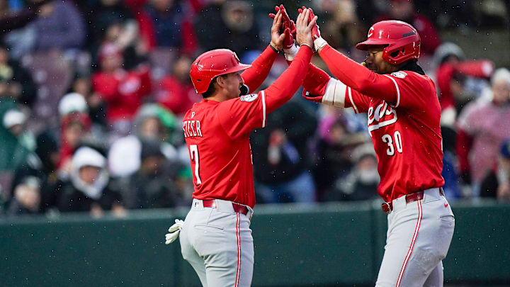 Reds prospects outfielder Will Benson (30) and designated hitter Spencer Steers (7) embrace each other after Benson hit a homer in the third inning of the final spring training game between the Cincinnati Reds and Reds prospects, Tuesday, March 25, 2025, at Day Air Ballpark in Dayton.