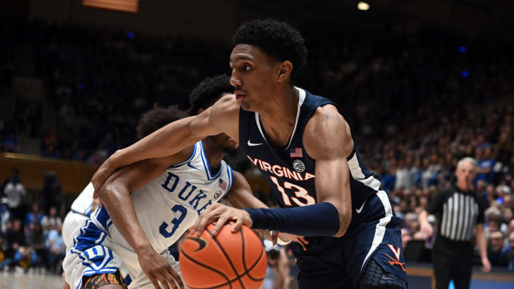 Mar 2, 2024; Durham, North Carolina, USA;  Virginia Cavaliers guard Ryan Dunn (13) drives to the basket a Duke Blue Devils guard Jeremy Roach (3) defends during the first half at Cameron Indoor Stadium. Mandatory Credit: Rob Kinnan-USA TODAY Sports