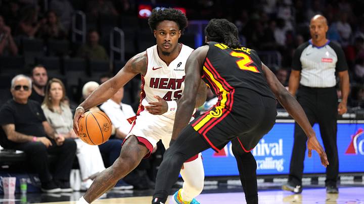 Apr 12, 2026; Miami, Florida, USA; Miami Heat guard Davion Mitchell (45) drives against Atlanta Hawks guard Keaton Wallace (2) during the second half at Kaseya Center. Mandatory Credit: Jim Rassol-Imagn Images Apr 12, 2026; Miami, Florida, USA; Miami Heat guard Davion Mitchell (45) drives against Atlanta Hawks guard Keaton Wallace (2) during the second half at Kaseya Center. Mandatory Credit: Jim Rassol-Imagn Images
