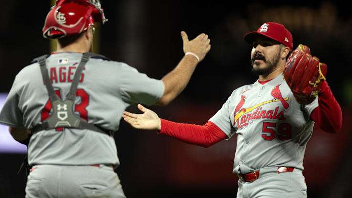 Sep 22, 2025; San Francisco, California, USA; St. Louis Cardinals catcher Pedro Pagés (43) and pitcher JoJo Romero (59) celebrate their 6-5 victory over the San Francisco Giants during the ninth inning at Oracle Park. Mandatory Credit: D. Ross Cameron-Imagn Images